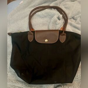 Longchamp bag small black, the handles are long not short and in good shape.
